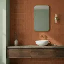 Carmine red glue-finish patterned wall tile with vertical curved panel design in square format, shown as a single display piece