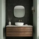 Black glue-finish patterned wall tile with a bold geometric relief texture in a square format, shown as a single display piece