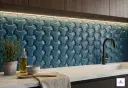 Blue 3D textured ceramic backsplash tiles with wave pattern for modern kitchen wall decoration.