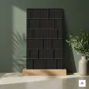 Matte black textured decorative wall panel tile with ribbed brick pattern for luxury interior wall design