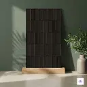 Crest Belegia Charcoal plain matt full body vitrified tile featuring a deep charcoal tone with a geometric block pattern and mixed textures in a matte finish, ideal for bold contemporary wall and floor interiors